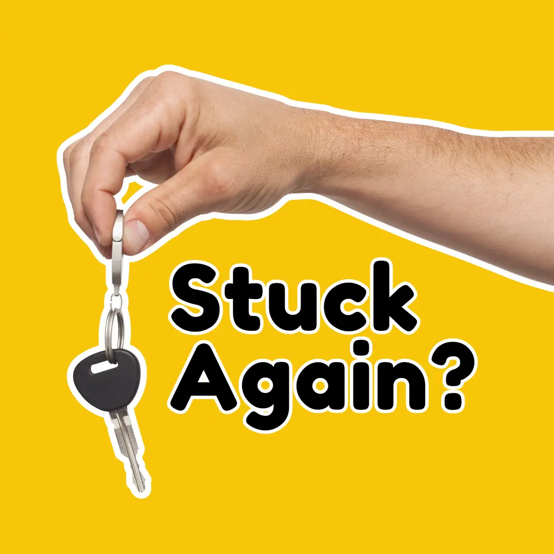 Holding Key with Stuck Again Sign